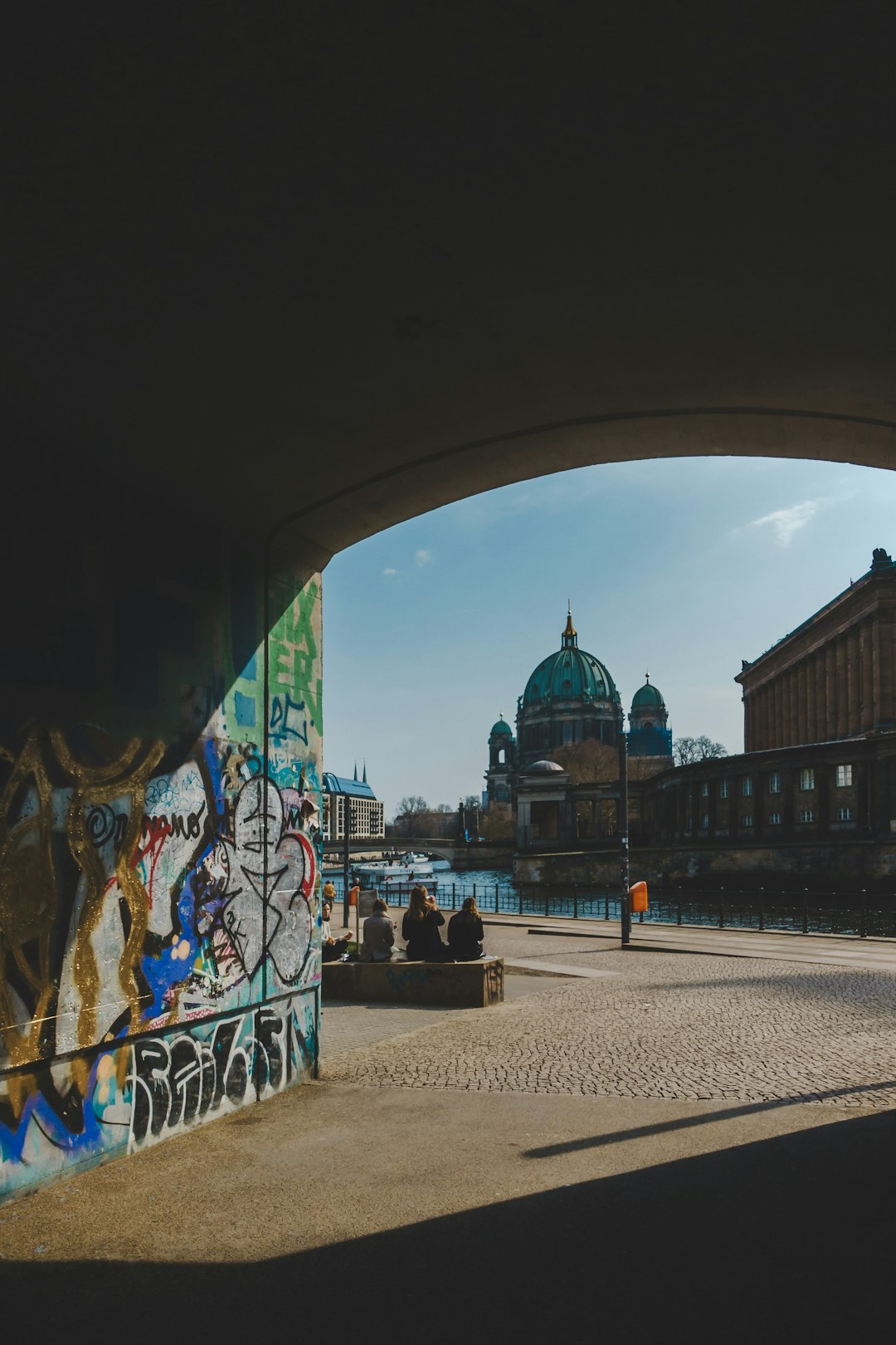 graffiti on tunnel wall near river