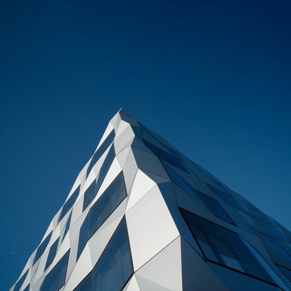 low angle photography of pyramid building under clear blue sky