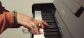 A close-up of hands playing the piano.