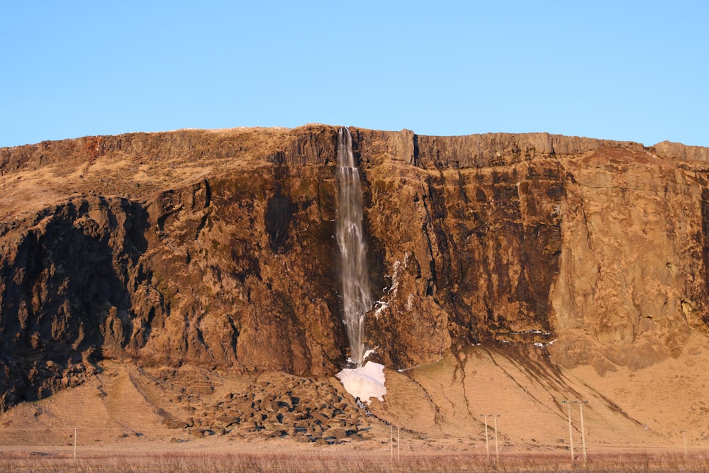 brown rocky mountain under blue sky