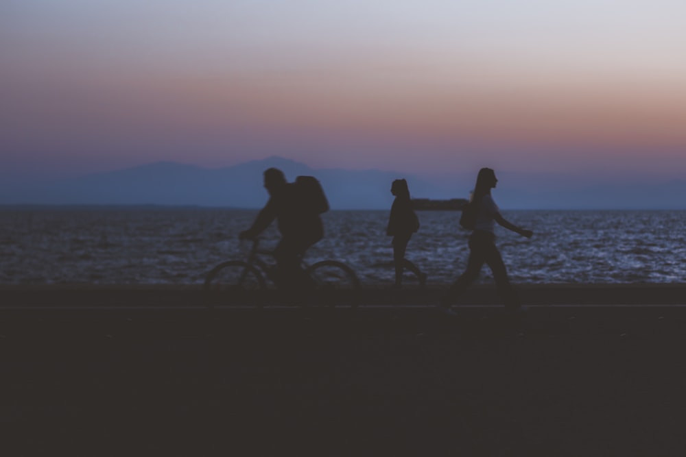 silhouette of three people