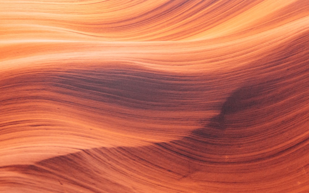 a close up of a rock formation with wavy lines