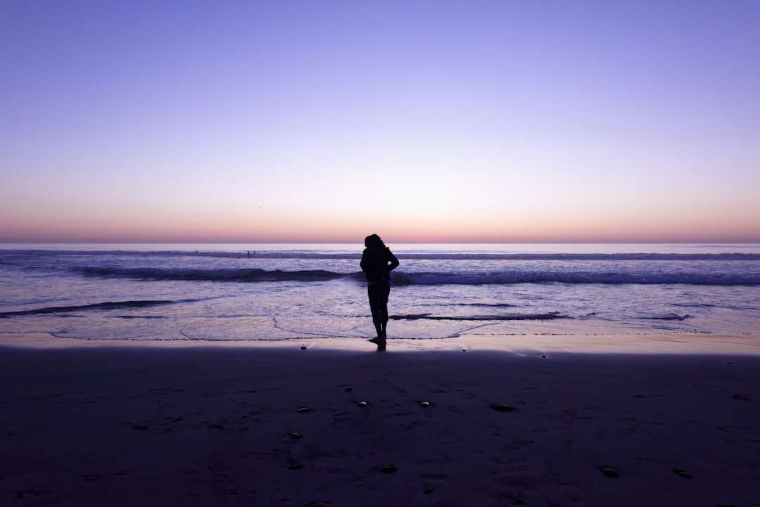 woman standing on seashoe