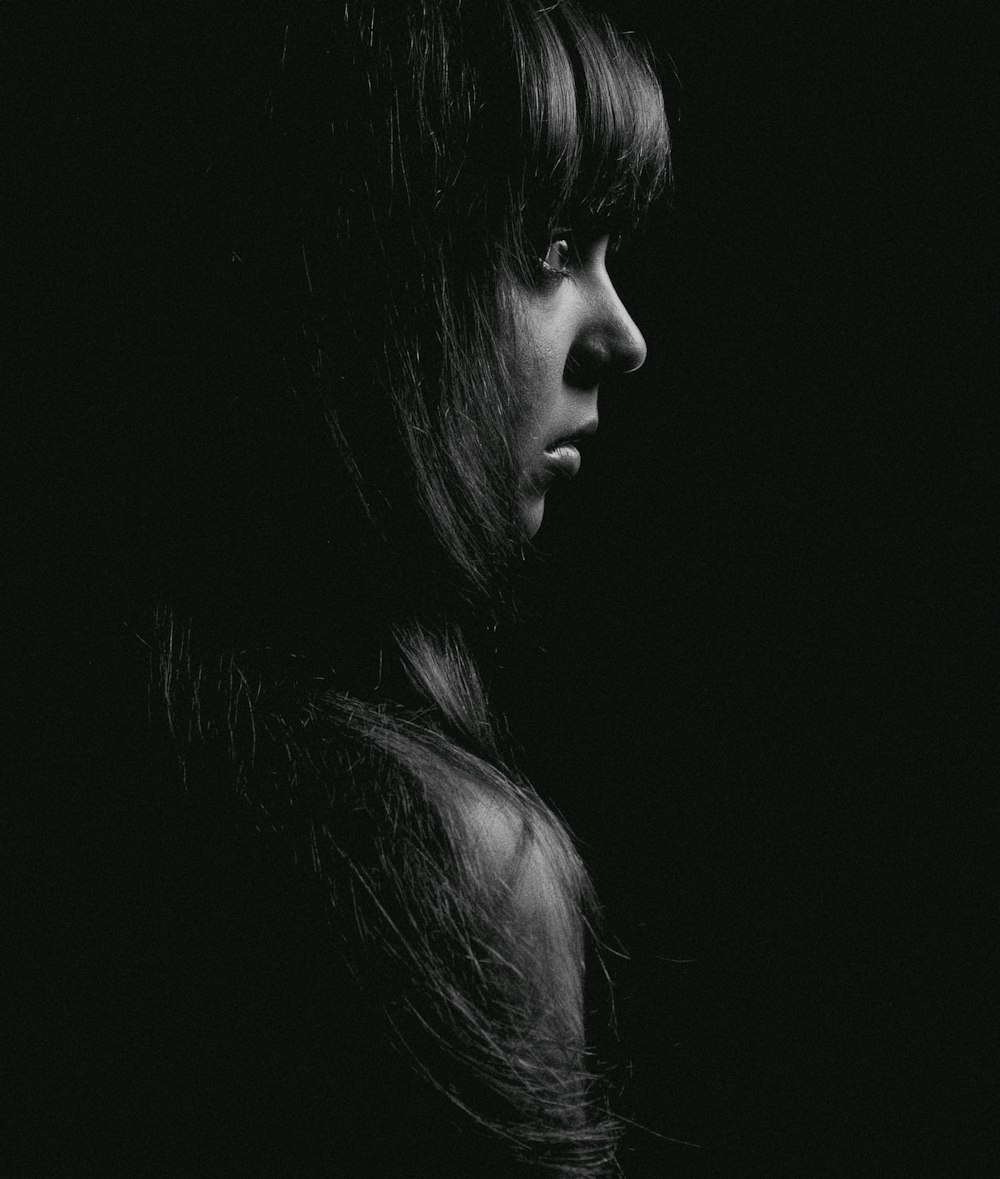 grayscale photography of woman facing to the side