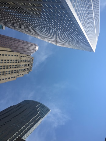 Modern residential towers rising against a clear blue sky, showcasing contemporary architecture.