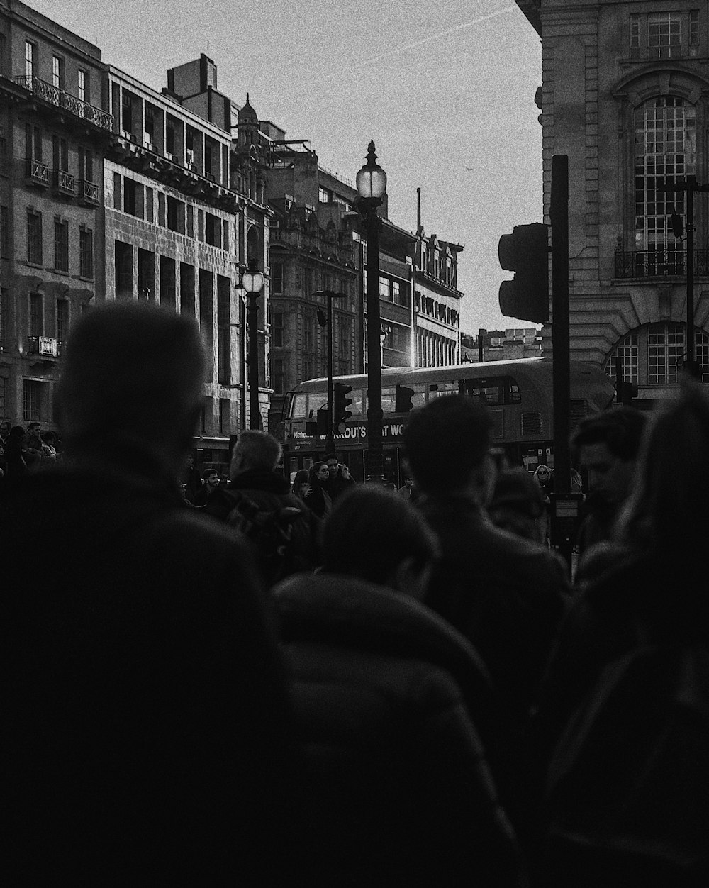 a black and white photo of a crowd of people