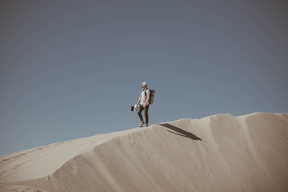 man standing in desert during daytime