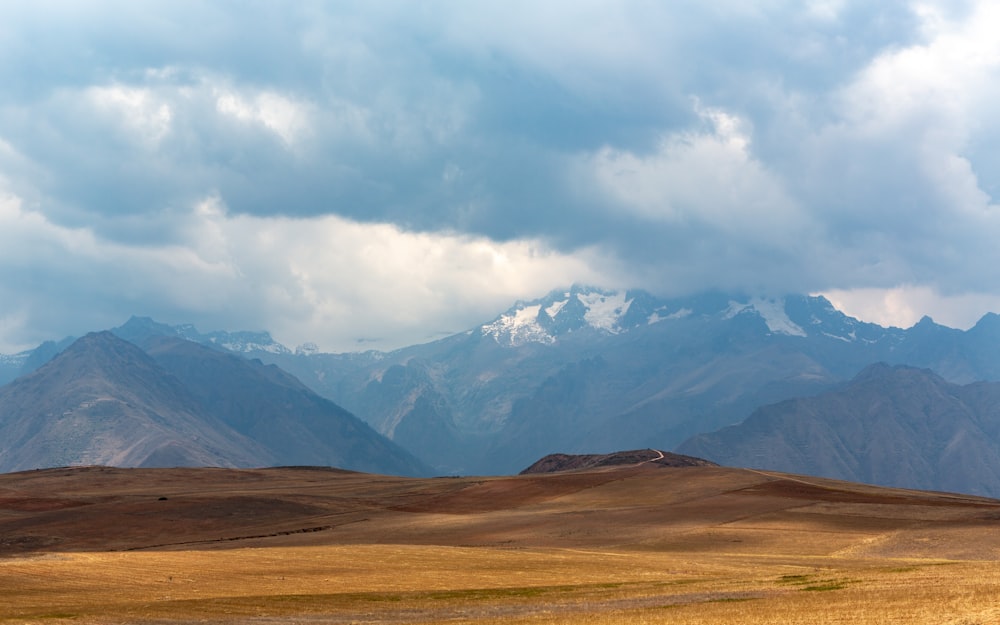 mountain range under grey clouds