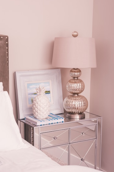 white and silver-colored table lamp