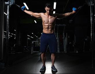 man exercising inside dim room