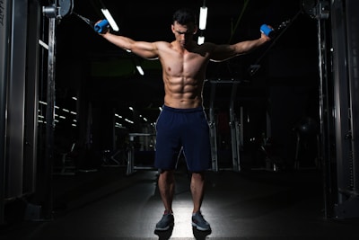 man exercising inside dim room