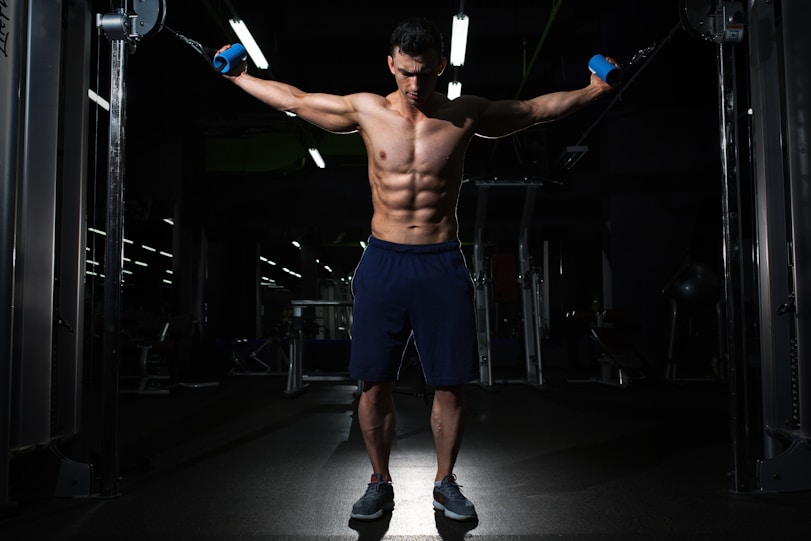 man exercising inside dim room