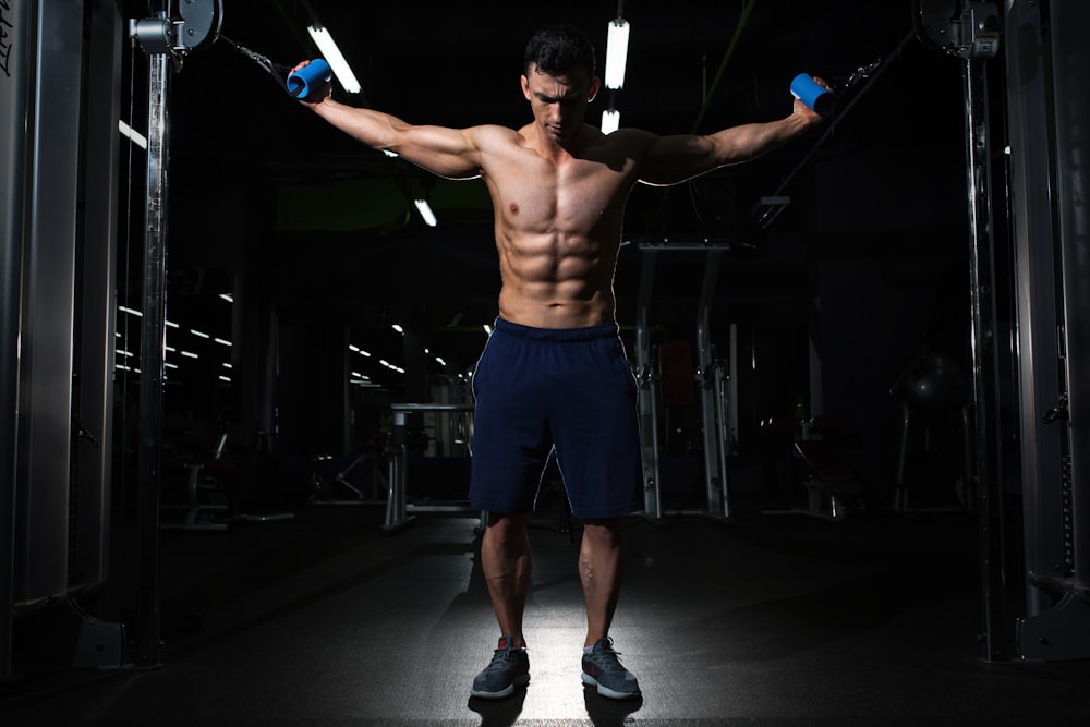 man exercising inside dim room