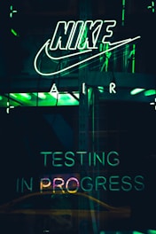 turned-on white Nike neon light signage
