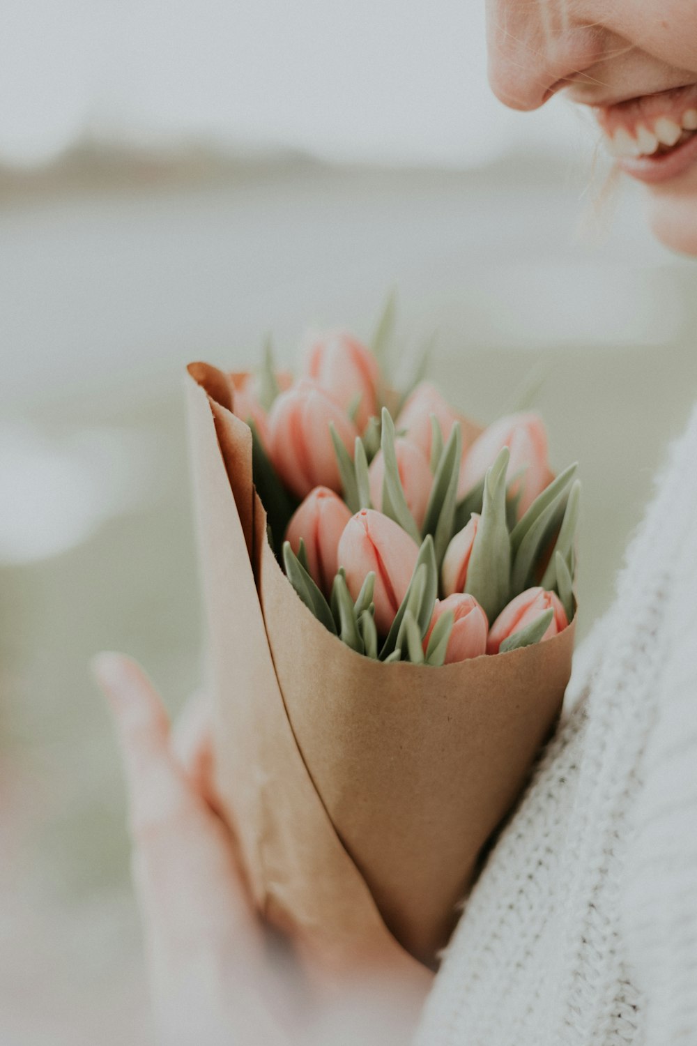 woman holding flower bouquet