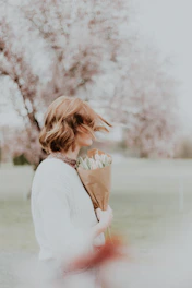 woman holding bouquet flower