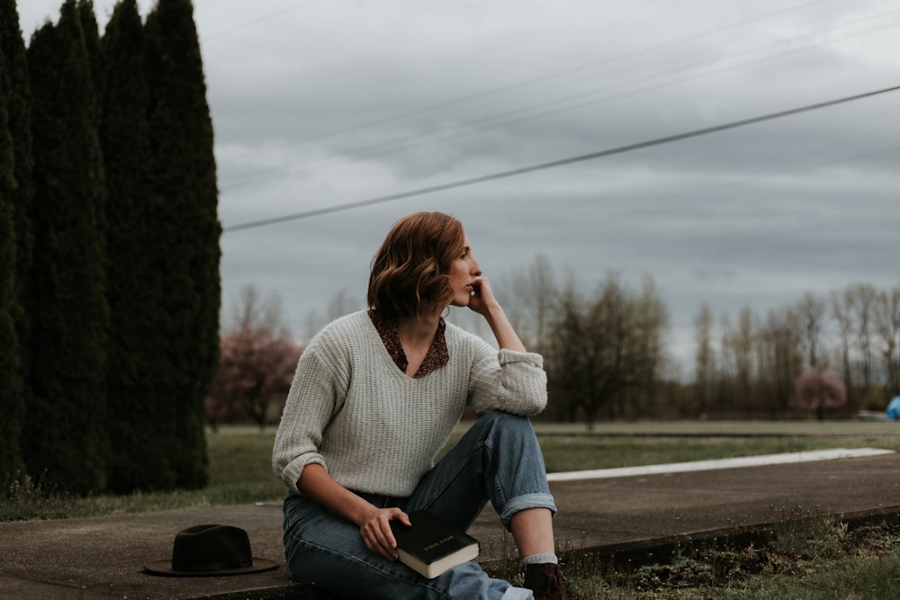 woman sitting on ground