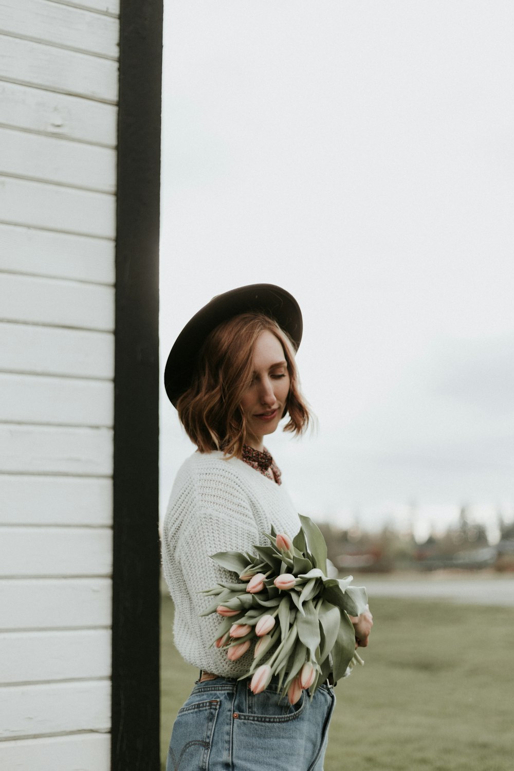 woman carrying tulip flowers