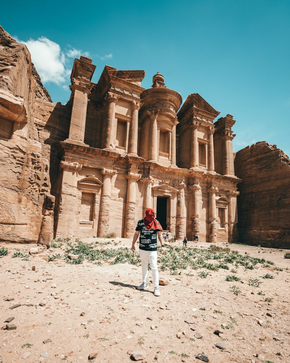 man standing beside Petra at daytime