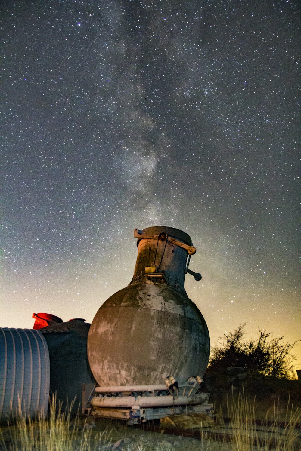 concrete vase-shaped building under starry night