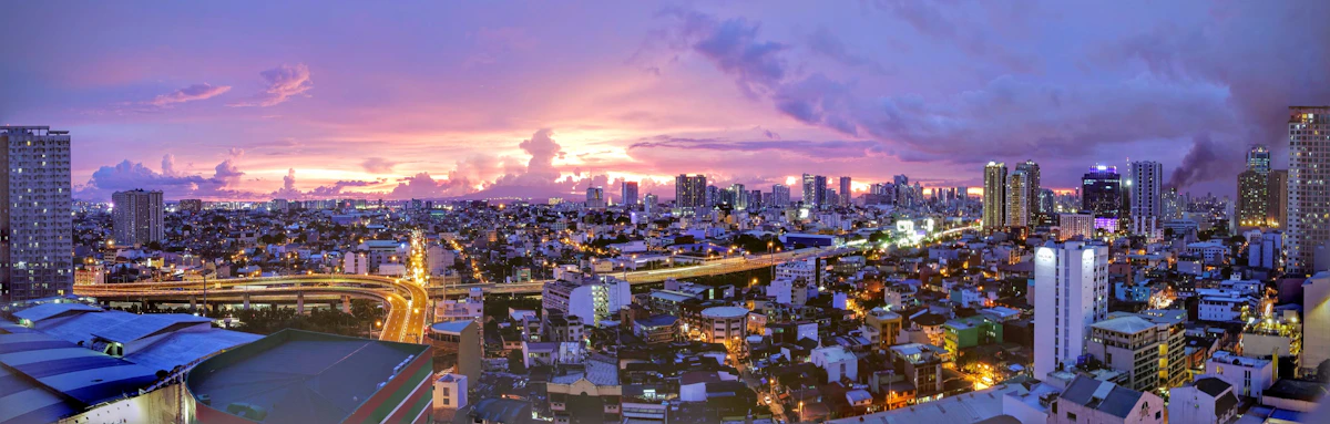 Aerial view of a dense urban city — millions of residents living in buildings of varying construction quality
