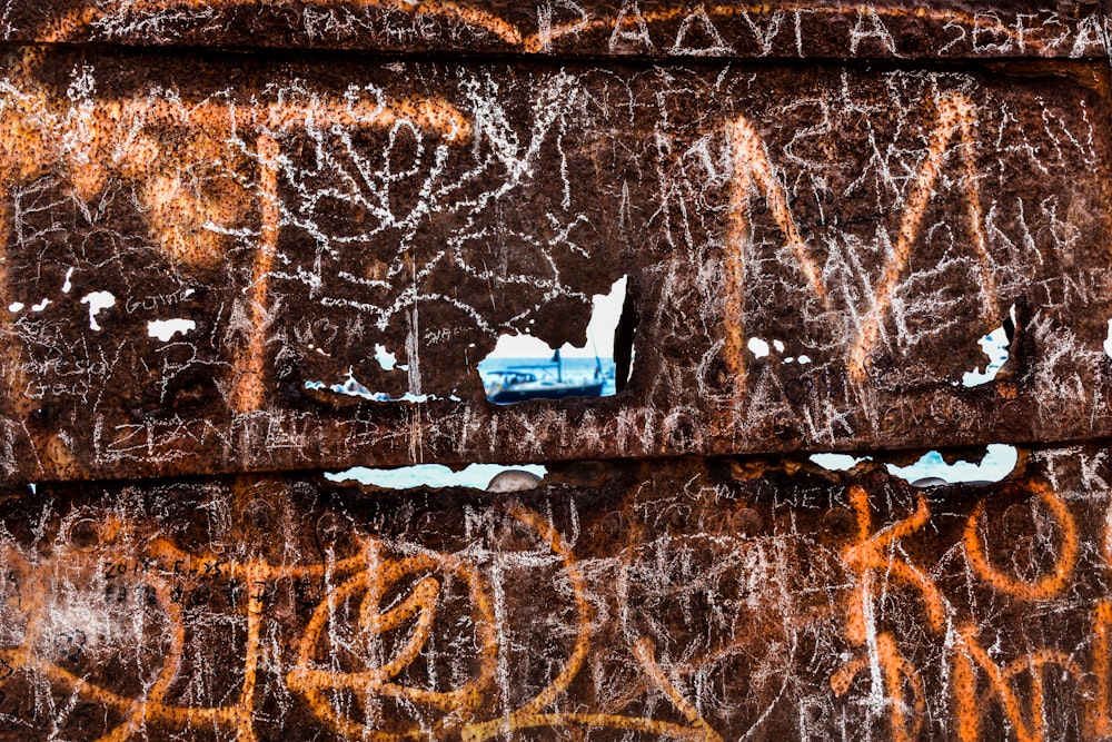 a close up of graffiti on the side of a building