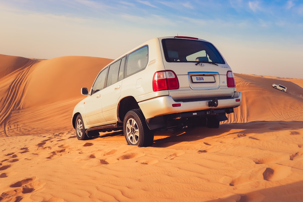 white SUV in dessert