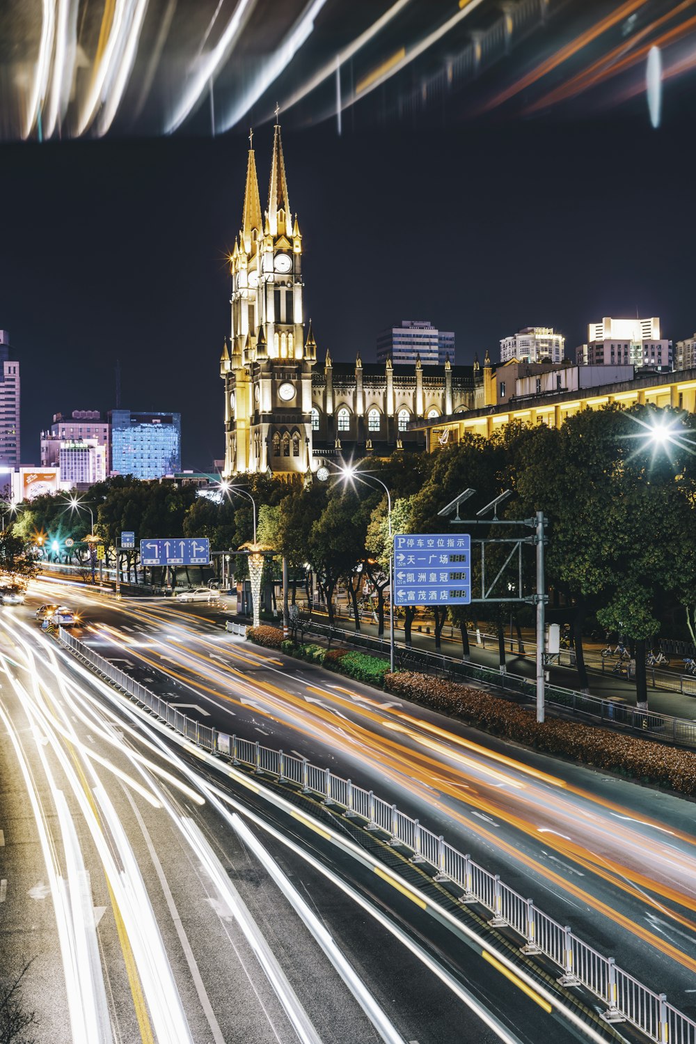 highway near cathedral during night time