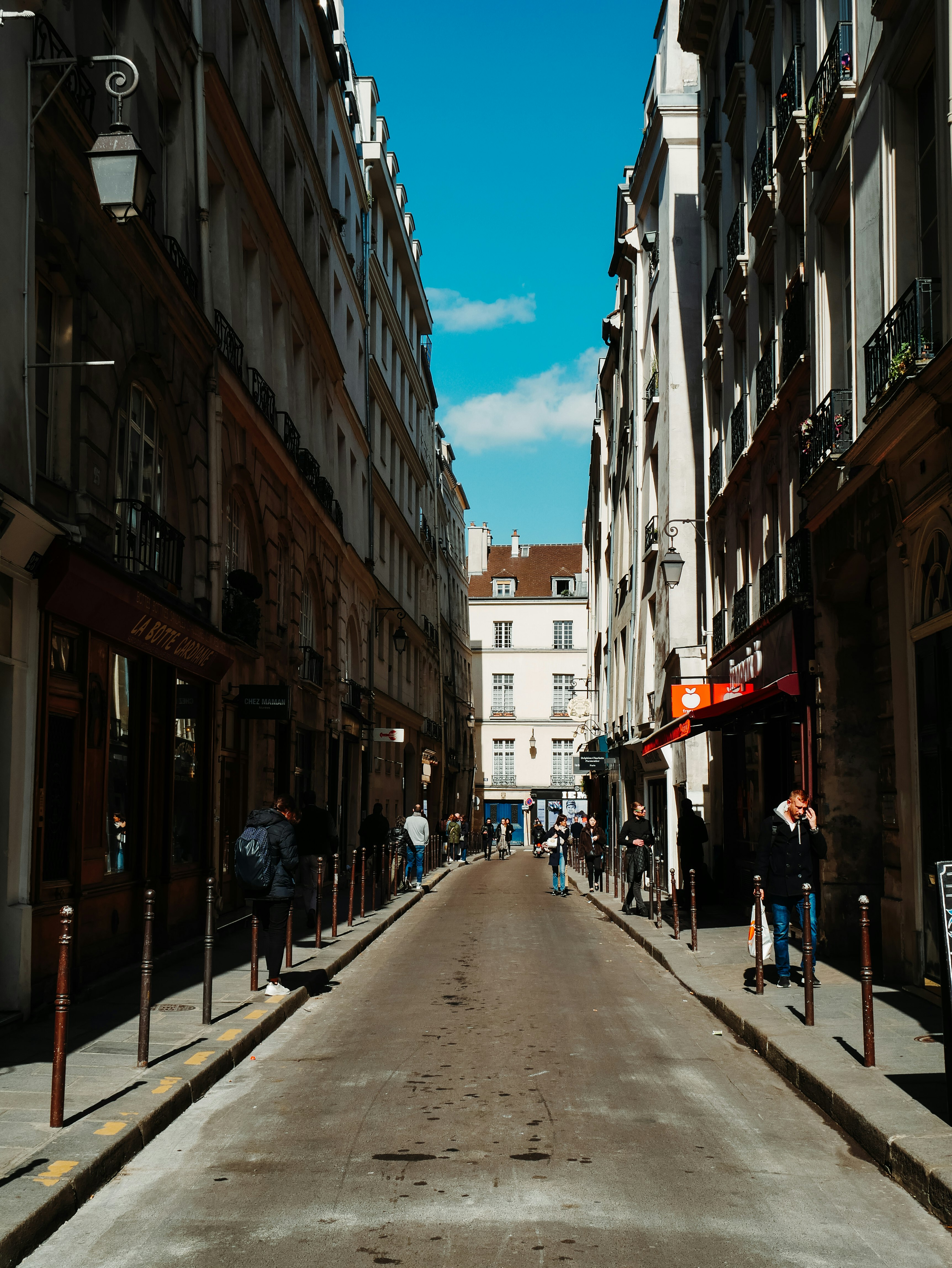 people walking on sidewalk during daytime