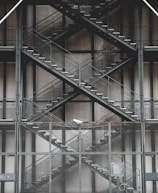 Security steps made of industrial grating in a factory.