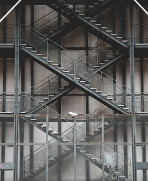 Security steps made of industrial grating in a factory.