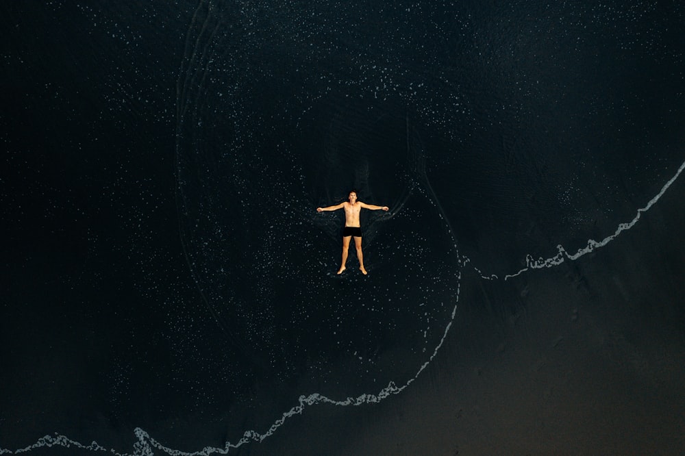 man lying on water