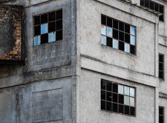 Industrial building foundation treated with protective waterproofing layers, showing durability.