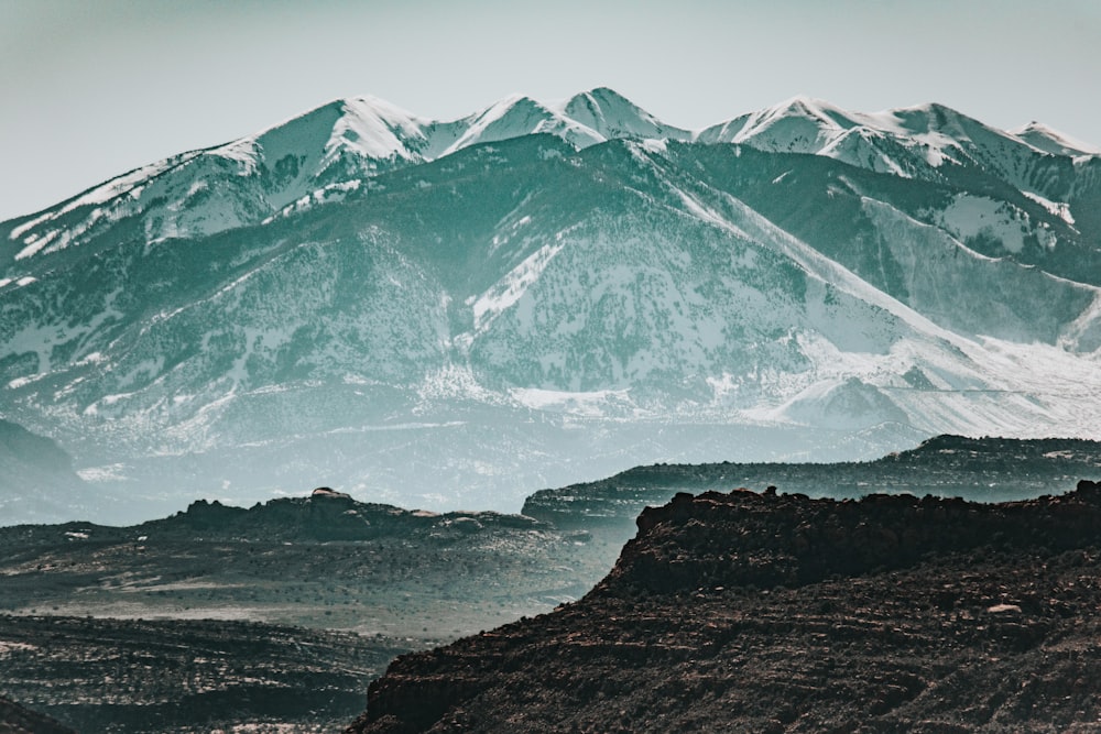 snow covered mountains under blue sky