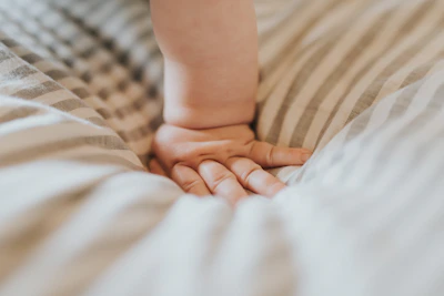 Close-up of soft handmade baby clothes in natural linen and cotton textures