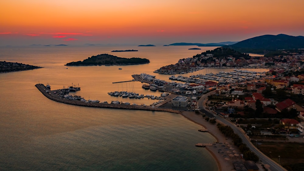 an aerial view of a marina at sunset
