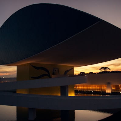 white and black concrete modernize building with lights on