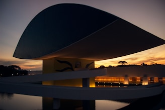 white and black concrete modernize building with lights on