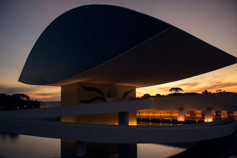 white and black concrete modernize building with lights on