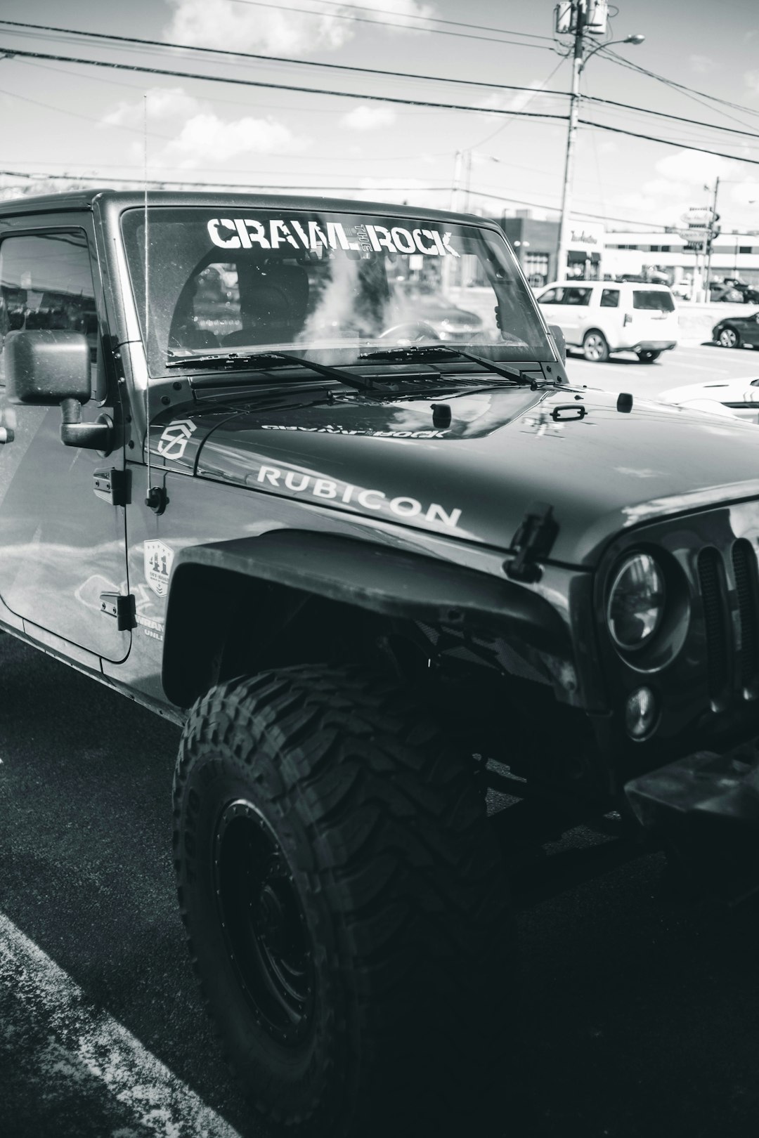grayscale photography of parked Jeep Wrangler Rubicon