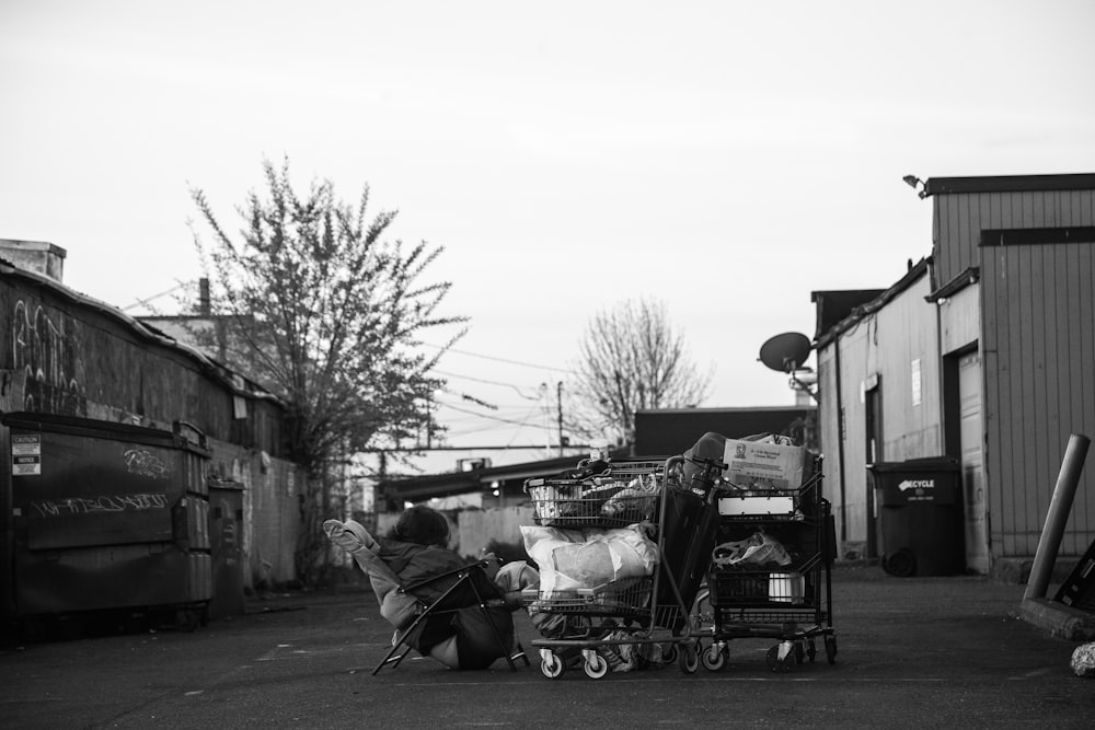 grayscale photography of houses and road view