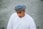 man in white thobe walking outdoors