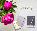 A minimalist flat lay featuring deep navy accessories representing Monday's mood.