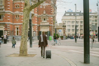 A scenic view of a happy traveler exploring a vibrant city with a suitcase.