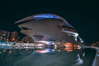 Futuristic foundation building with sleek dark design and glowing blue accents.