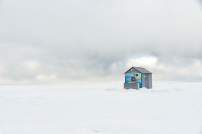 An ice fishing hut with a compact diesel heater keeping the chill away.