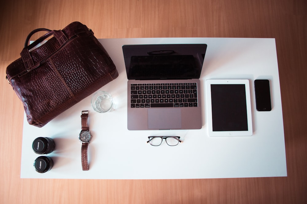 Apple Macbook Pro, iPad and iPhone on table