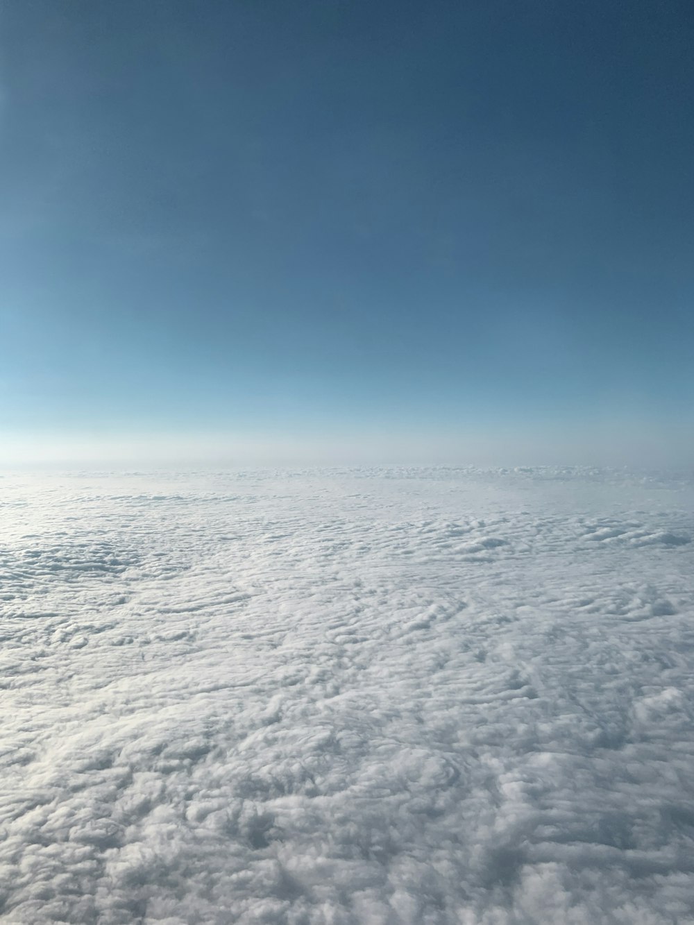 white clouds covering ground below