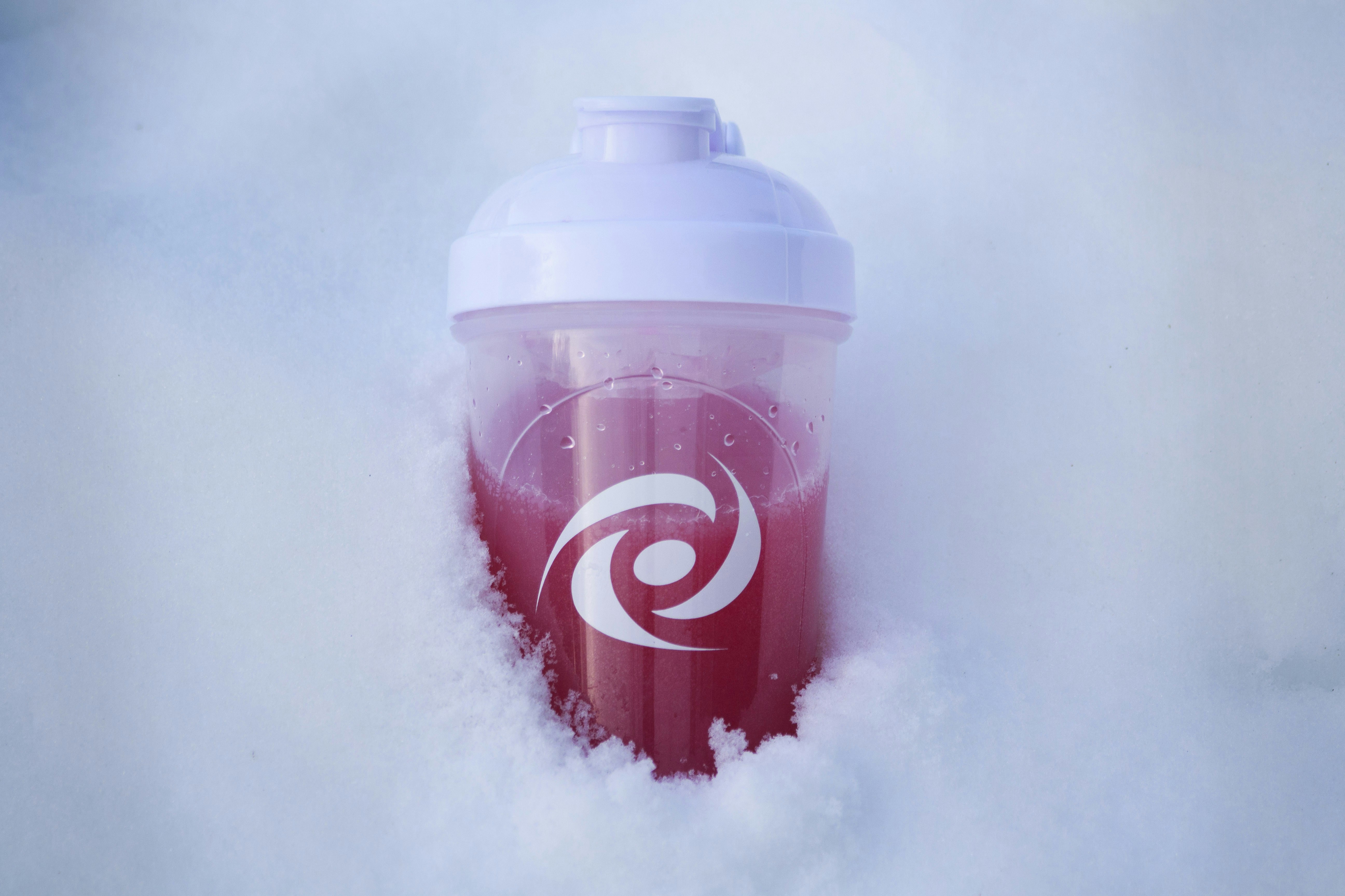 Red sports drink in shaker bottle