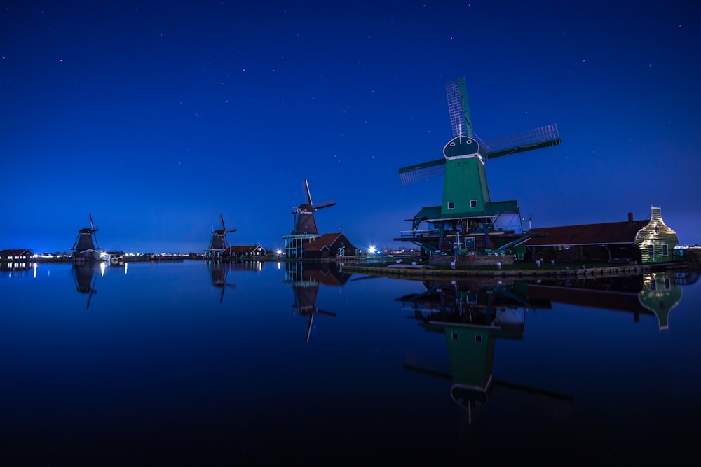 reflection photography of green windmill